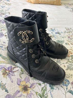 CHANEL 21A Black Quilted Leather Lace-Up Boots with Gold Chain CC